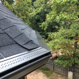 Gutter system completed by Impact Siding and Roofing